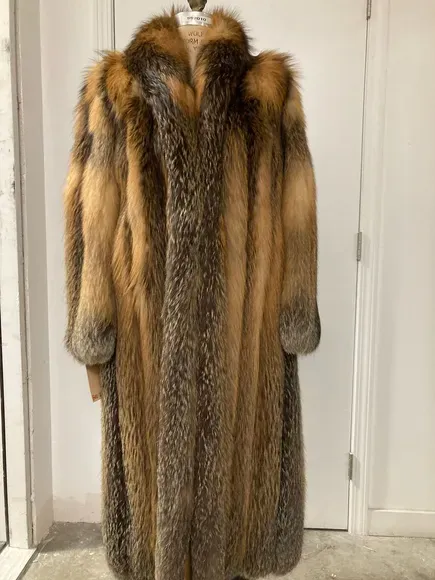 A cross fox coat on a dress form, single view