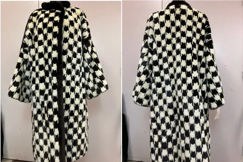 A black and white houndstooth mink coat photographed front and back against the Edwards-Lowell workroom wall