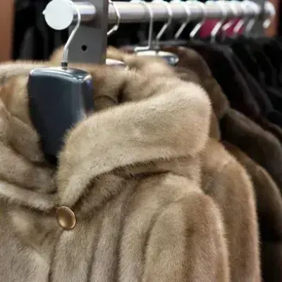 Fur coats hanging on a rack inside the Edwards-Lowell salon in Los Angeles